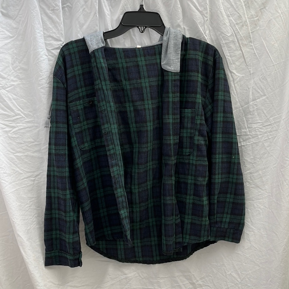 green and blue flannel top with grey sweatshirt hood